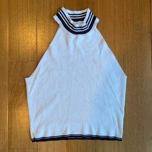 White mock neck with black detailing on trim